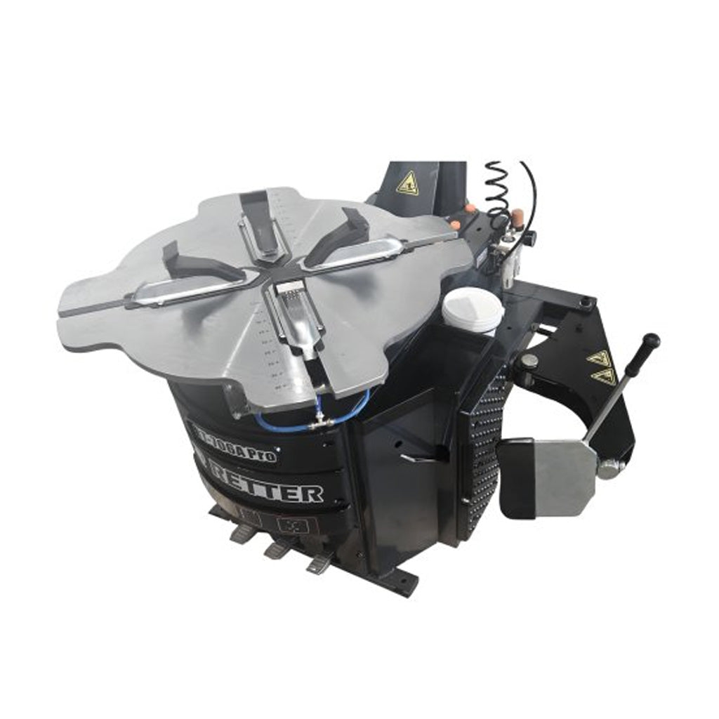 Montażownica do opon RT-706A PRO – metalowy stół roboczy z samocentrującymi kłami i bocznym ramieniem dociskowym.